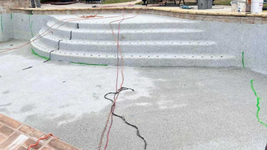 Green Highlights Indicate Cracks in the Pool’s Concrete Shell